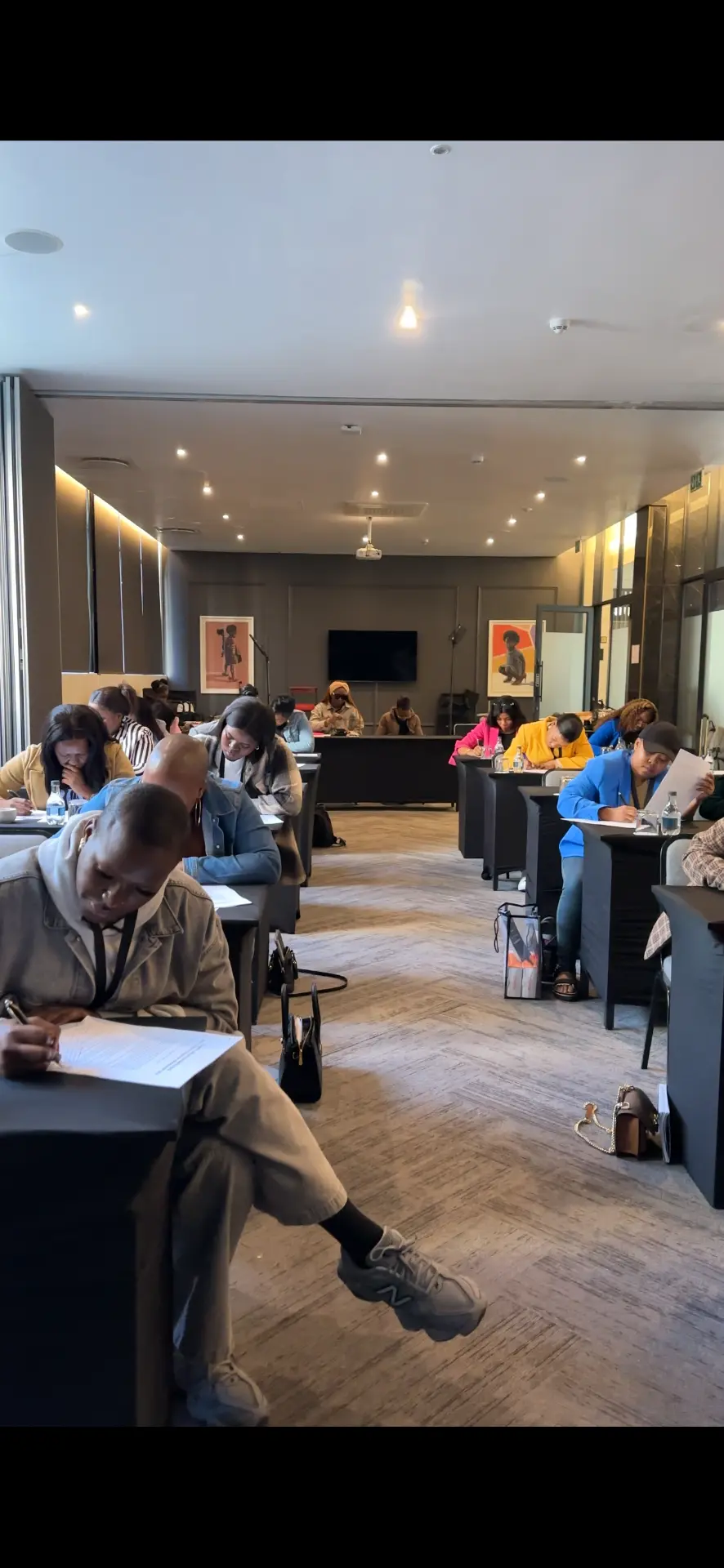 Students completing written work during a masterclass