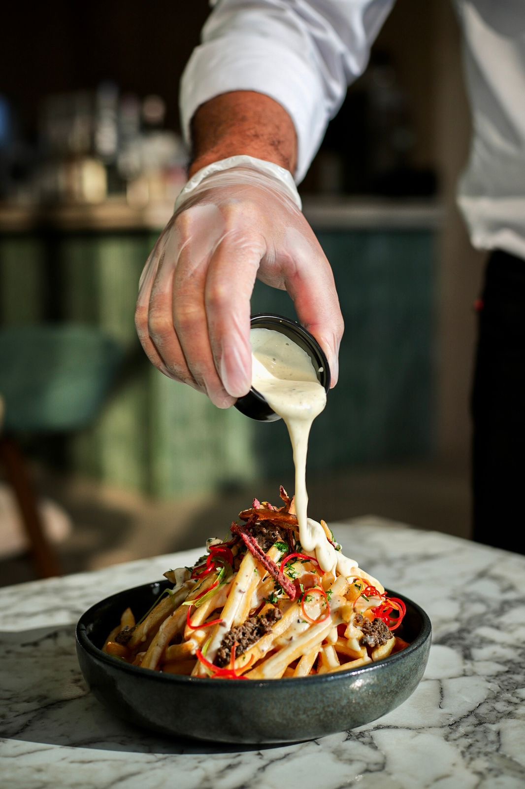 Chef serving a plated dinner