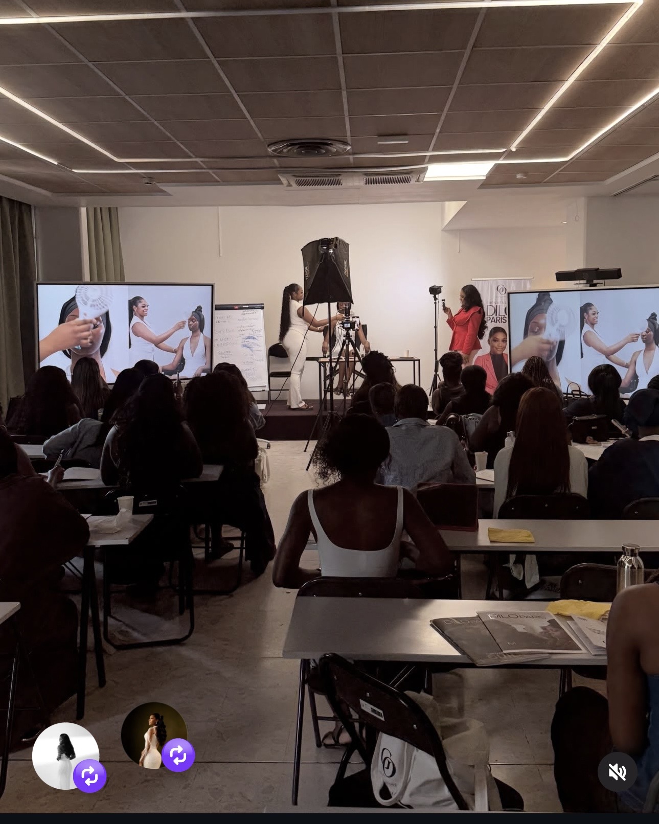 A live makeup demonstration before a full DILO Paris classroom